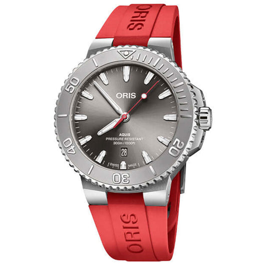 The ORIS Aquis Date Relief Caliber 733 is a 43.5mm automatic watch featuring a sunray grey dial, date window, bold markers, rotating bezel with minutes scale, and a red rubber “ORIS” strap. Water-resistant up to 300 meters.