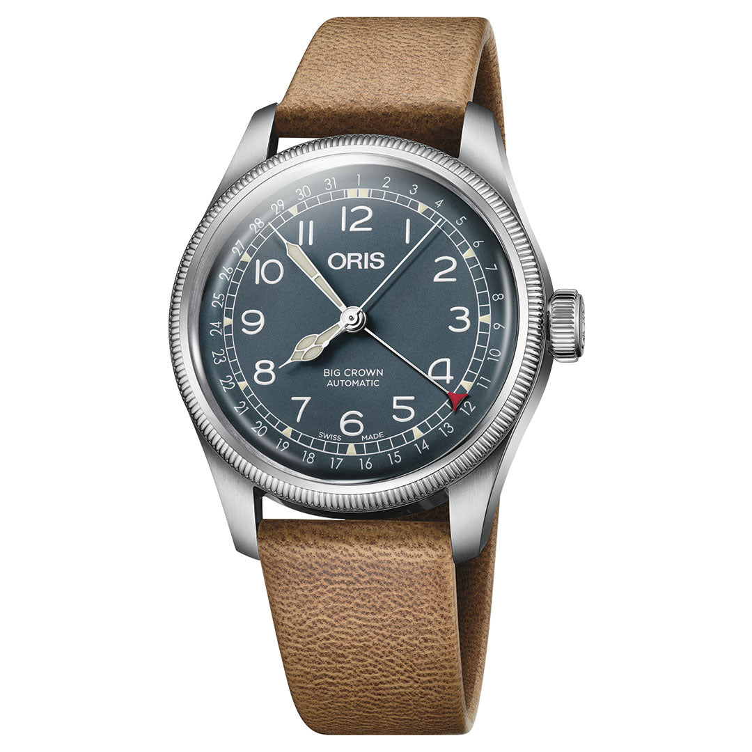 The ORIS Big Crown Pointer Date Calibre 754 Automatic 40mm features a silver case, blue dial with white Arabic numerals, brown leather strap, notched bezel, and a red-tipped pointer date hand for classic aviation-inspired style.