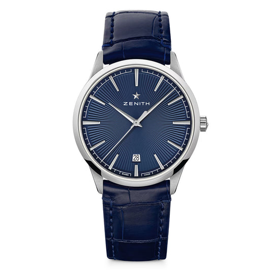 The ZENITH Elite Classic Elite 670 40.5mm Watch features a blue face with silver indices in a stainless steel case, date display at 6 o'clock, and luxurious blue alligator leather strap, highlighted by the iconic "Zenith" brand name on the dial.