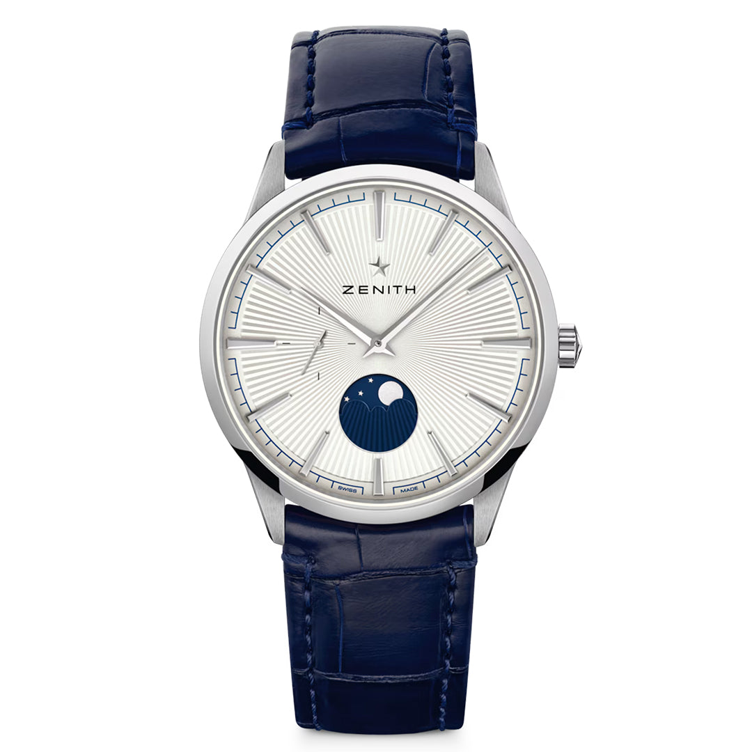 The ZENITH Elite Moonphase Elite 692 40.5mm Watch showcases a radial silver dial, minimalist hour markers, automatic winding, a blue moon phase at 6 o'clock, and a blue alligator leather strap with "Zenith" at the top center.