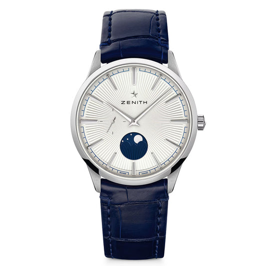 The ZENITH Elite Moonphase Elite 692 40.5mm Watch showcases a radial silver dial, minimalist hour markers, automatic winding, a blue moon phase at 6 o'clock, and a blue alligator leather strap with "Zenith" at the top center.