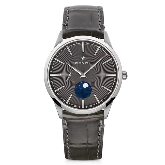 The ZENITH Elite Moonphase Elite 692 40.5mm Watch features a black leather strap, silver case, and ultra-thin dark gray radial-patterned dial. It includes a moon phase display, slender silver hour markers and hands, and offers an automatic winding mechanism.