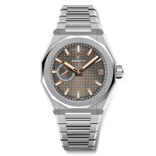 The ZENITH Defy Skyline El Primero 3620 41mm watch features a patterned gray dial with small seconds sub-dial, date display, and an interchangeable steel bracelet. It includes luminescent silver and orange hands and indices, highlighted by the trademark ZENITH four-pointed star.