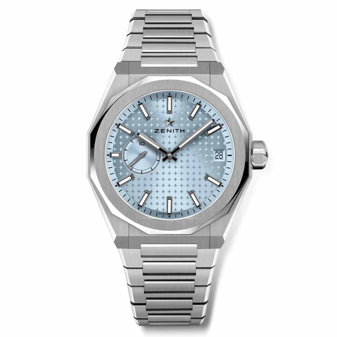 The ZENITH DEFY Skyline El Primero 3620 Automatic 41mm Watch from Zenith features a contemporary design with a silver case and a light blue, patterned dial adorned with the brand's logo. It includes an automatic movement and a date window at the 3 o'clock position, complemented by minimalist hour markers and a brushed metal strap.