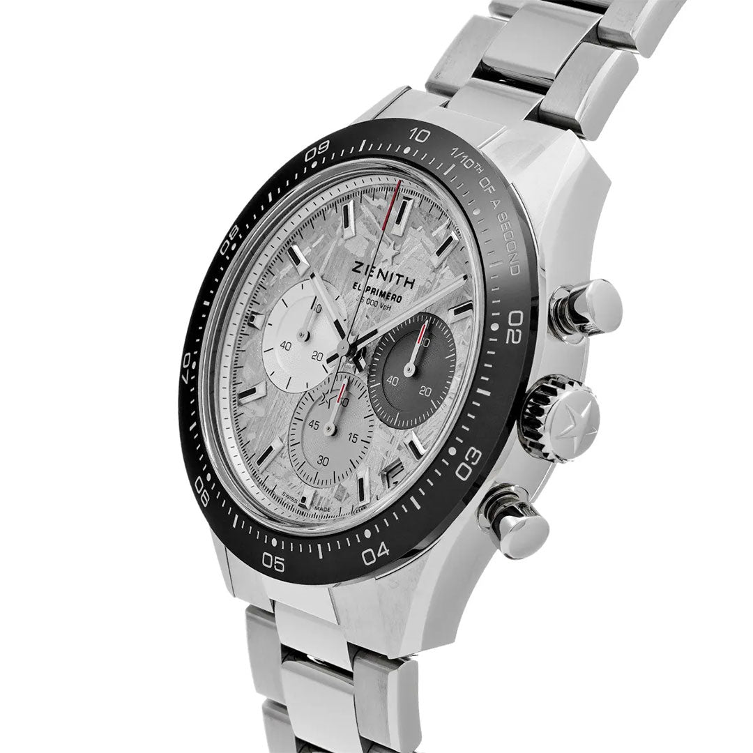 A Zenith Chronomaster Sport El Primero 3600 Automatic Chronograph 41mm watch with a textured dial, three subdials, black bezel, and metal bracelet is displayed at an angle on a white background.