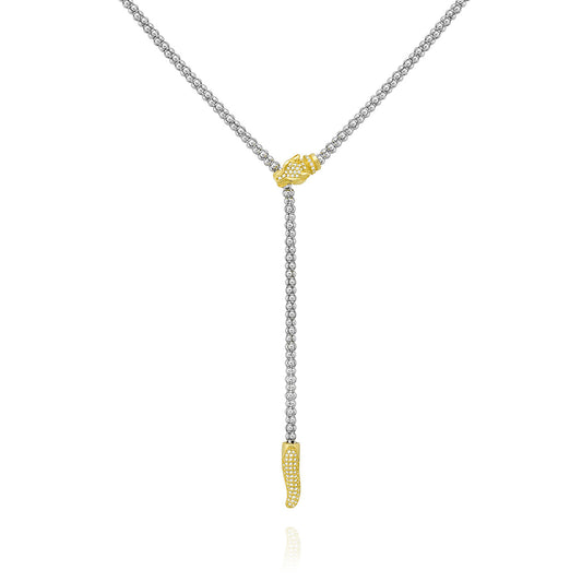 The Miss Mimi Lioness Red Eye Lariat Necklace by Yael showcases a unique snake-like design crafted from sterling silver. It is accentuated by an 18kt yellow gold vermeil snake head at the center, with the motif extending to a stylized serpent tail in gold. This elegant piece measures 52cm in length.