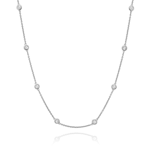 The Miss Mimi by Yael Sterling Silver Cubic Zirconia Station Necklace showcases a delicate design of small round cubic zirconia accents connected by a fine chain, all displayed on a white background.