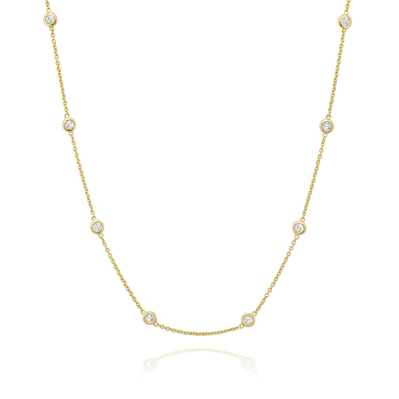 The Miss Mimi by Yael 18K Yellow Gold Vermeil and Sterling Silver Cubic Zirconia Station Necklace features a minimalist and elegant design, with evenly spaced cubic zirconia accents delicately adorning the slender chain. Displayed on a plain white background, it exudes understated sophistication.