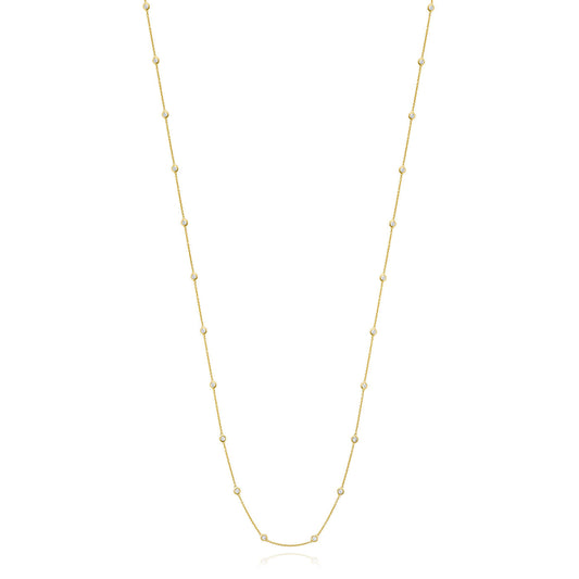 The Miss Mimi by Yael 18K Yellow Gold Vermeil and Sterling Silver Cubic Zirconia Station Necklace features a delicate design with small, evenly spaced beads along the chain. Its simple and elegant style makes it perfect for everyday wear, exuding timeless charm against a plain white background.