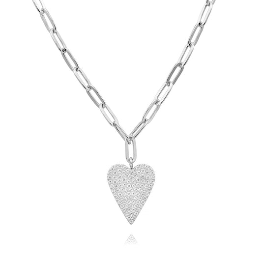 The Miss Mimi by Yael Sterling Silver Paperclip Chain showcases an elegant pave heart pendant adorned with sparkling diamonds. Enhanced with rhodium bonding for added brilliance, it's presented against a white background.