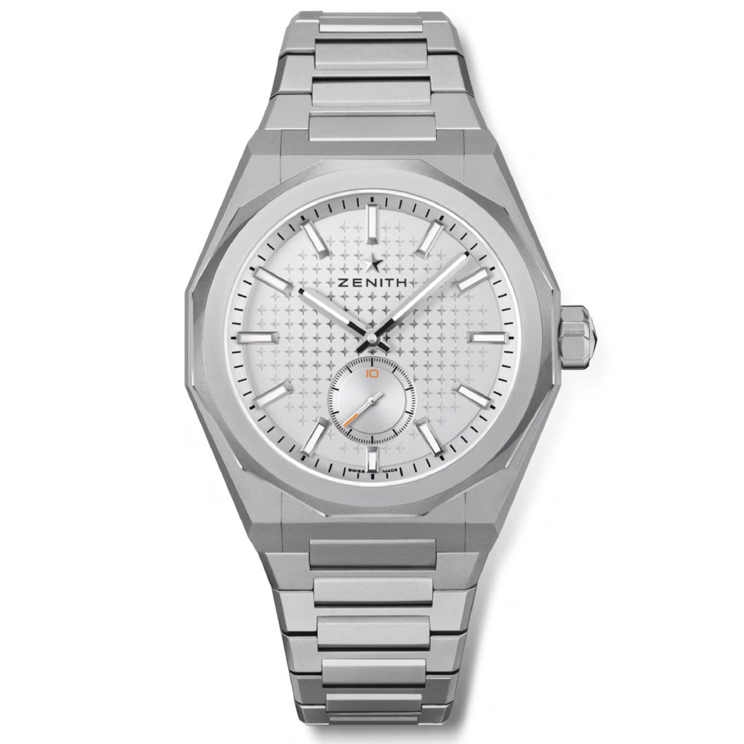 The Zenith DEFY Skyline C.X. El Primero 3620 SK is a 41mm limited edition watch (200 pcs) featuring a silver geometric case, metal bracelet, white patterned dial with silver markers, date at 3 o'clock, and small seconds at 9.