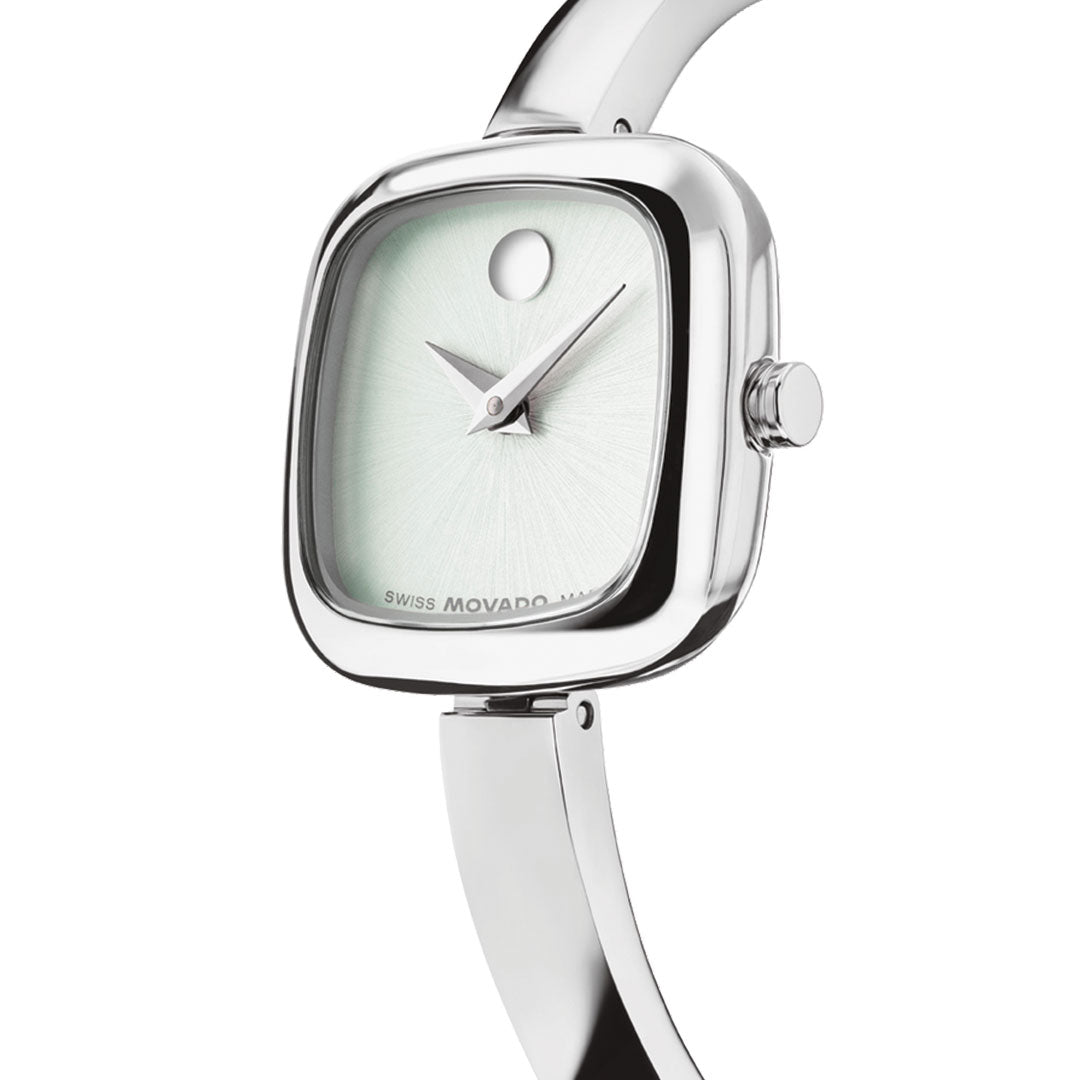 The Movado Museum Bangle Quartz 21.5mm Watch features a polished silver-tone case and band with a minimalist white dial and signature dot at 12 o’clock—offering sleek, modern style from Movado.