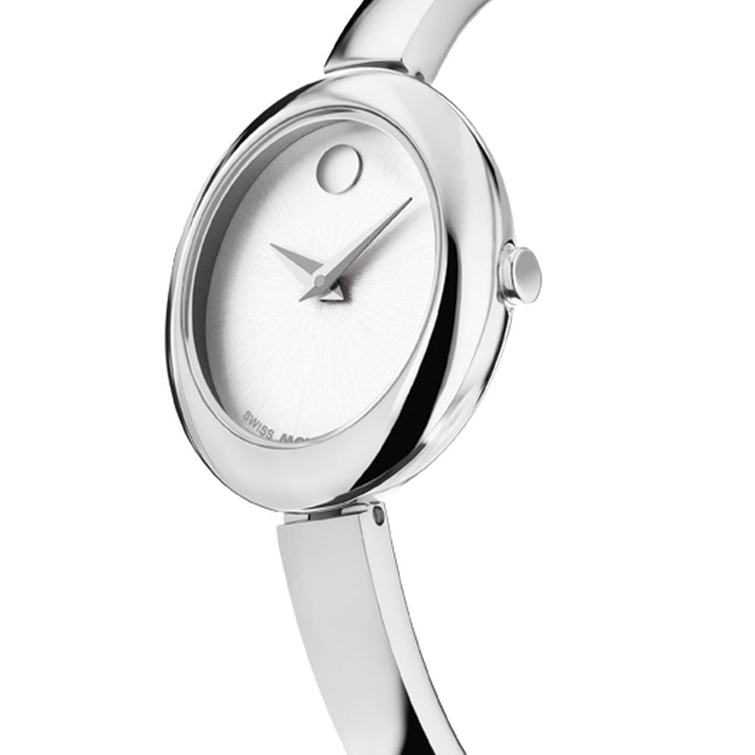 The Movado Museum Bangle Quartz 21.5mm Watch features a sleek silver finish, an oval silver white sunray dial with minimalist design and a signature dot at 12 o’clock, capturing elegant, jewelry-inspired style by Movado.