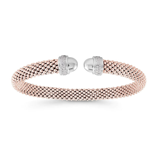 A close-up image showcases the Miss Mimi by Yael's "Miss Mimi Sterling Silver with 18K Rose Gold Vermeil Mesh Round Edge Cuff Bracelet." This exquisite open-ended bangle features a textured beaded design, accented with intricately detailed spherical sterling silver caps at each end.