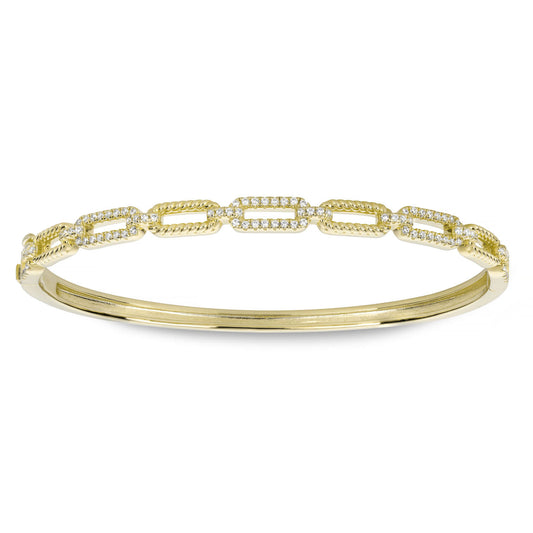 Introducing the Miss Mimi 18K Yellow Gold Vermeil with Cubic Zirconia Bangle by Miss Mimi by Yael, this exquisite piece features a series of interlinked oval shapes adorned with sparkling cubic zirconia stones. The interconnected design lends the bangle an elegant and refined appearance.