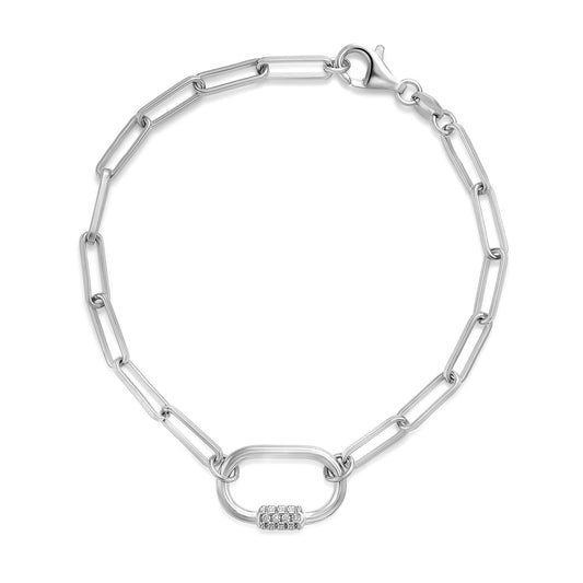 Introducing the Miss Mimi by Yael Sterling Silver Paper Clip Link Chain Bracelet, featuring elongated links and a secure lobster clasp. The centerpiece showcases a bold oval link enhanced with a delicate cluster of cubic zirconia gemstones.