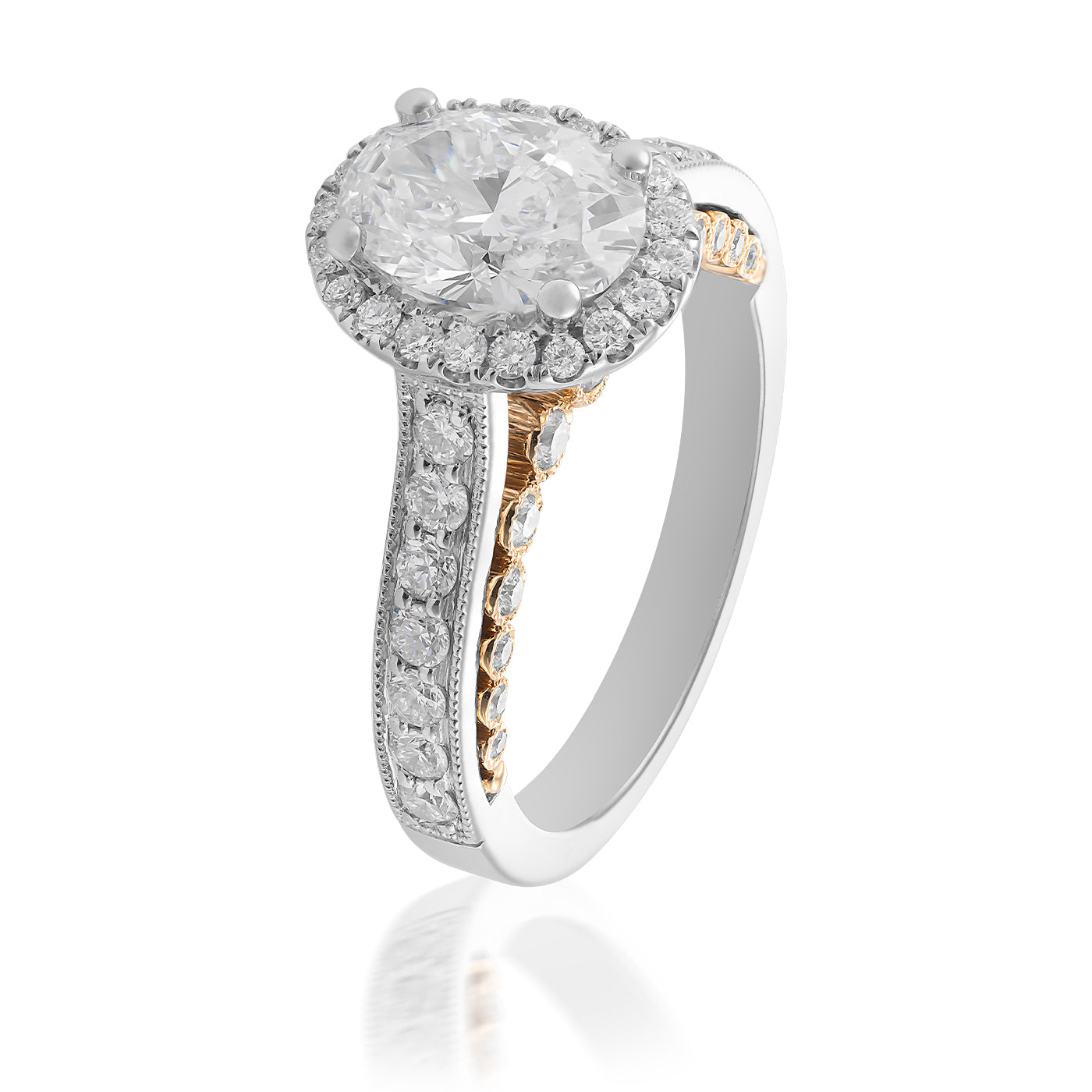 This gorgeous oval halo diamond engagement ring from Raffi&Co features a prominent center diamond surrounded by a halo of smaller diamonds. Crafted from 18K yellow and white gold, the band includes intricate detailing and additional diamonds for enhanced brilliance. GIA certified for quality assurance.