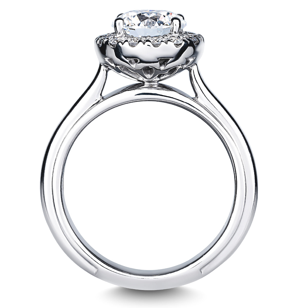 Raffi&Co.® 14K White Gold Round Brilliant Diamond Halo Engagement Ring showcasing a round diamond in a prong setting, adorned with intricate detailing on the band. The ring is displayed upright against a white background.