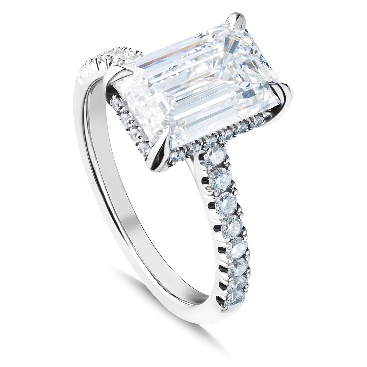 The Raffi&Co.® 14K White Gold Emerald Hidden Halo Diamond Engagement Ring showcases a stunning emerald-cut diamond in a prong setting. The band is embellished with smaller round diamonds, adding extra sparkle and elegance to this exquisite diamond engagement ring from Raffi&Co.