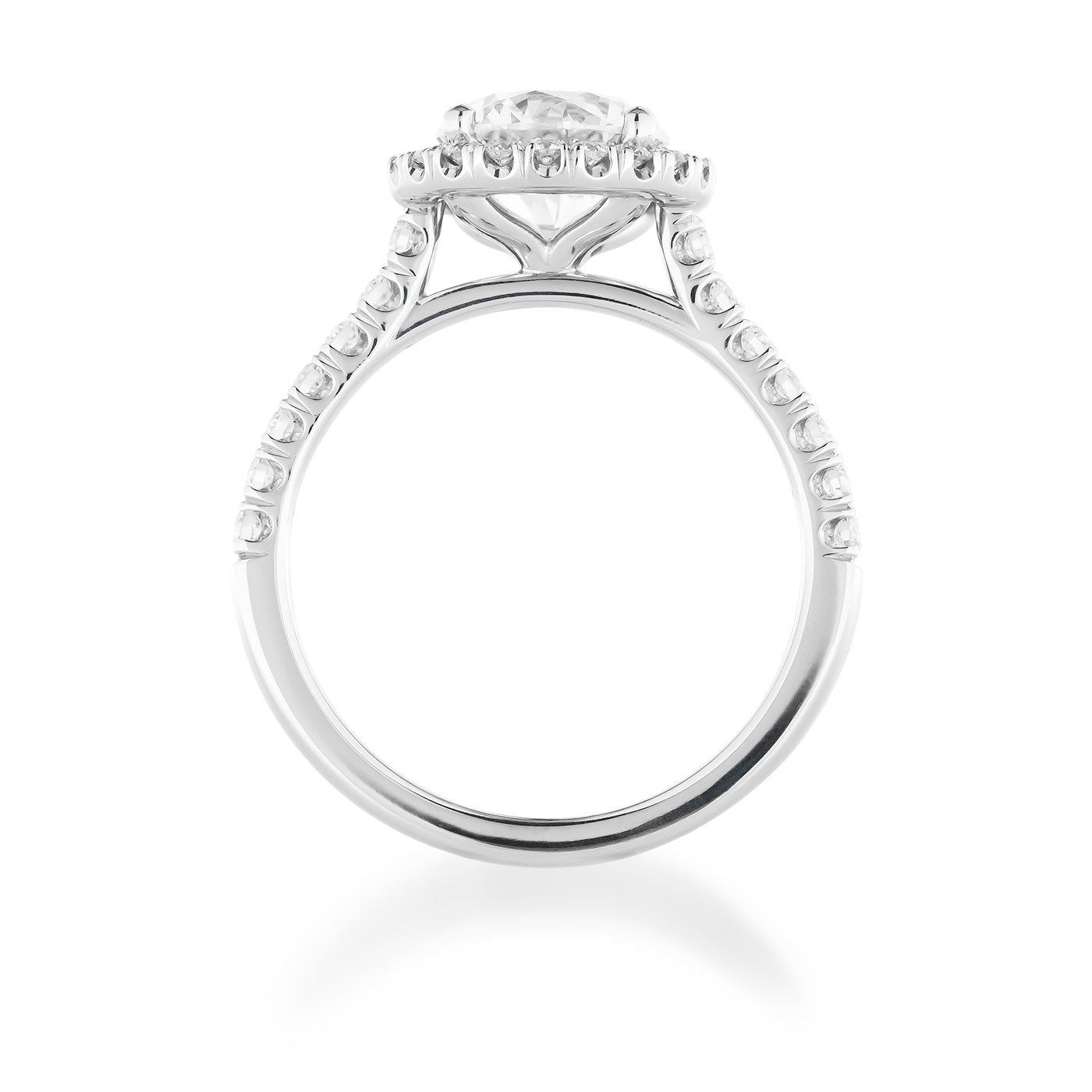 The Raffi&Co. Signature 14K White Gold Round Brilliant Halo Diamond Engagement Ring features a prominent central round brilliant diamond in a raised basket setting, with an elegant band accented by smaller diamonds for added sparkle and sophistication.