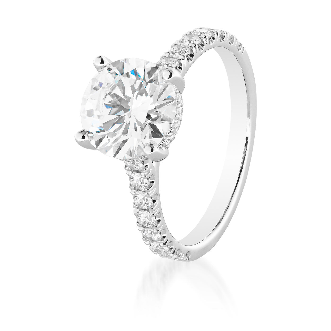 The Raffi&Co.® 14K White Gold Round Brilliant Hidden Halo Diamond Engagement Ring showcases a large, GIA-certified round diamond centerpiece, elegantly surrounded by a hidden halo of smaller diamonds along the band. Displayed against a plain white background, this masterpiece from Raffi&Co embodies timeless elegance and exquisite craftsmanship.