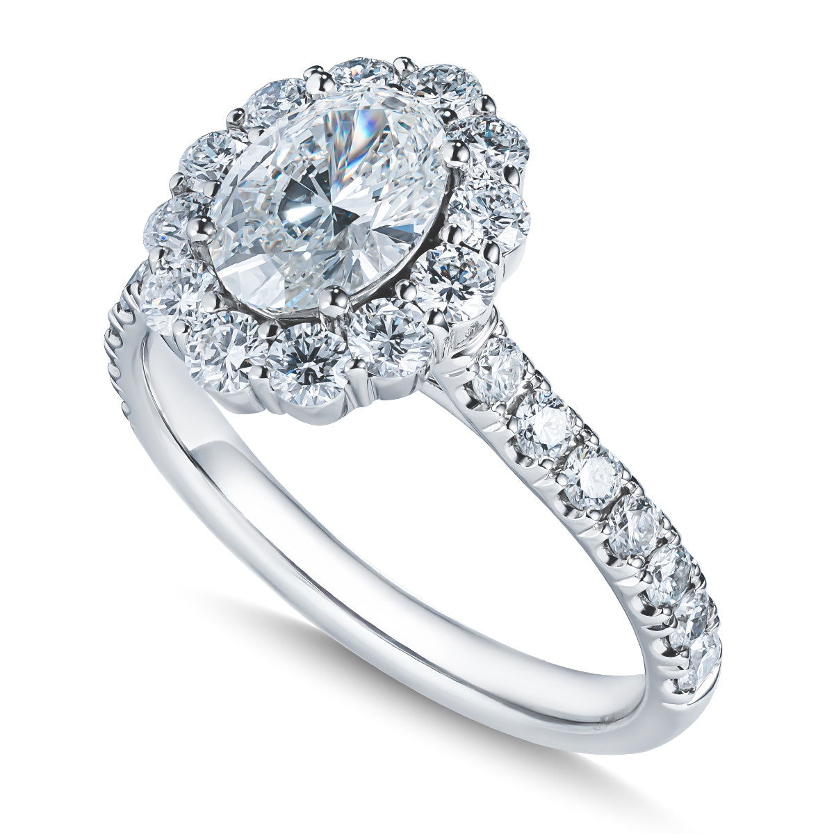 The Raffi&Co® 14K White Gold Oval Halo Diamond Engagement Ring features a GIA Certified oval halo diamond, beautifully set in white gold. The band is embellished with additional round diamonds, enhancing its brilliance and sophistication.