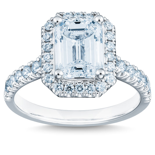 The Raffi&Co.® 14K White Gold Emerald Halo Diamond Engagement Ring features a striking emerald-cut diamond at its center, encircled by a halo of smaller round diamonds. The band, made of 14K white gold, is embellished with additional radiant diamonds and is GIA certified for outstanding quality and craftsmanship.