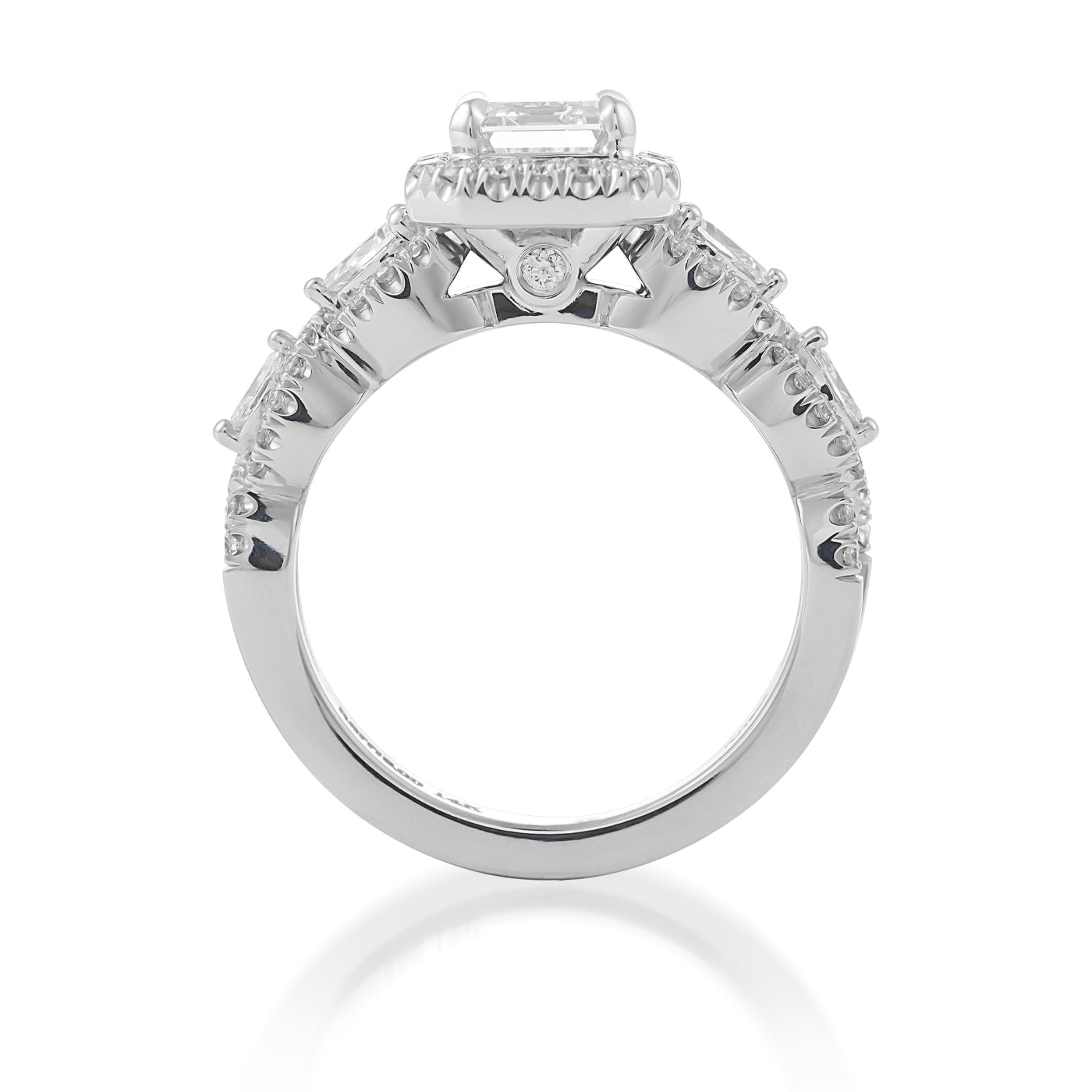 The Raffi&Co.® 14K White Gold Emerald Halo Diamond Engagement Ring, crafted by Raffi&Co, elegantly showcases a GIA-certified rectangular diamond at its center, complemented by smaller stones along the band against a pristine white background.