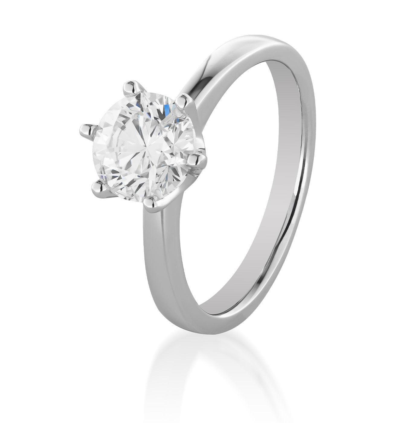 Introducing the Raffi&Co.® 18K White Gold Round Brilliant Solitaire Diamond Engagement Ring, a beautiful piece from Raffi&Co featuring a round brilliant diamond elegantly set in a classic six-prong design, showcased against a pristine white background.