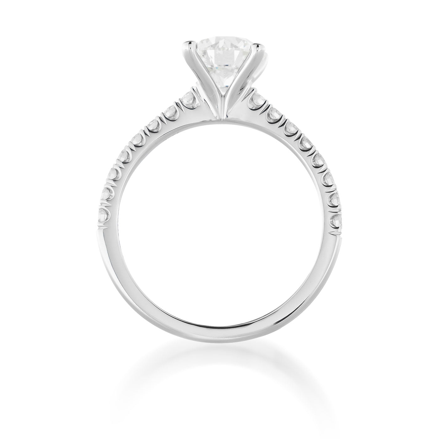 Introducing the Raffi&Co.® 18K White Gold Round Brilliant Solitaire Diamond Engagement Ring, a masterpiece of elegance and luxury. This exquisite piece from Raffi&Co features a round brilliant diamond with SI2 clarity, prominently displayed in a classic prong setting. The band is beautifully designed with delicate round embellishments along the top half, adding an extra touch of sophistication to this stunning engagement ring.