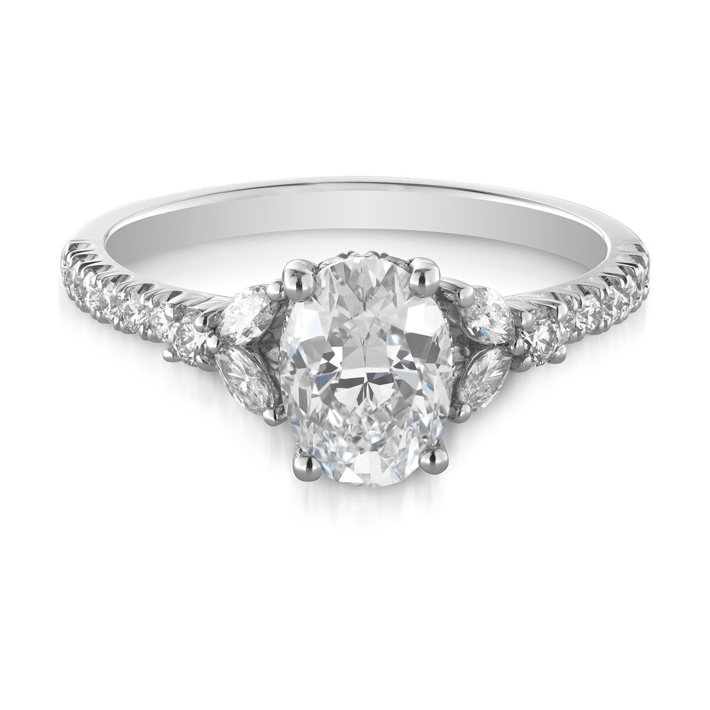 The Raffi&Co.® Platinum Oval with Cushion Cut Hidden Halo Three Stone Diamond Engagement Ring showcases an elegant oval-cut center diamond, elegantly accented by a hidden halo and additional round diamonds along the band for added sparkle.