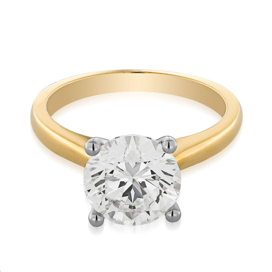 Presenting the Raffi&Co.® 18K Yellow Gold Round Brilliant Solitaire Diamond Engagement Ring, embellished with a dazzling solitaire diamond set in four prongs and beautifully showcased against a white backdrop.