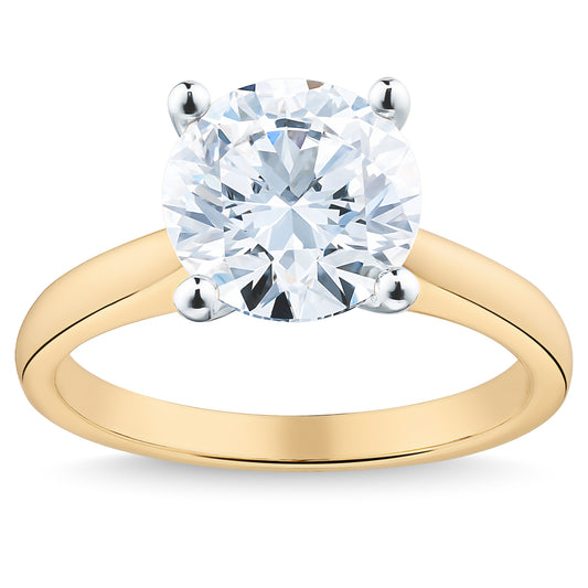 This dazzling Raffi&Co.® Signature 18K Yellow Gold Round Brilliant Solitaire Diamond Engagement Ring features a solitaire diamond in a four-prong setting, elegantly placed on an 18K yellow gold band with a smooth, polished finish.