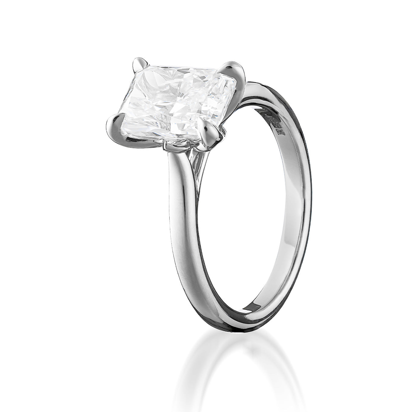 Introducing the Raffi&Co.® 14K White Gold Radiant Solitaire Lab Diamond Engagement Ring, featuring a dazzling square 2.50 carat lab diamond set in a classic prong design and elegantly displayed on a white background. This exquisite piece from Raffi&Co embodies timeless sophistication.