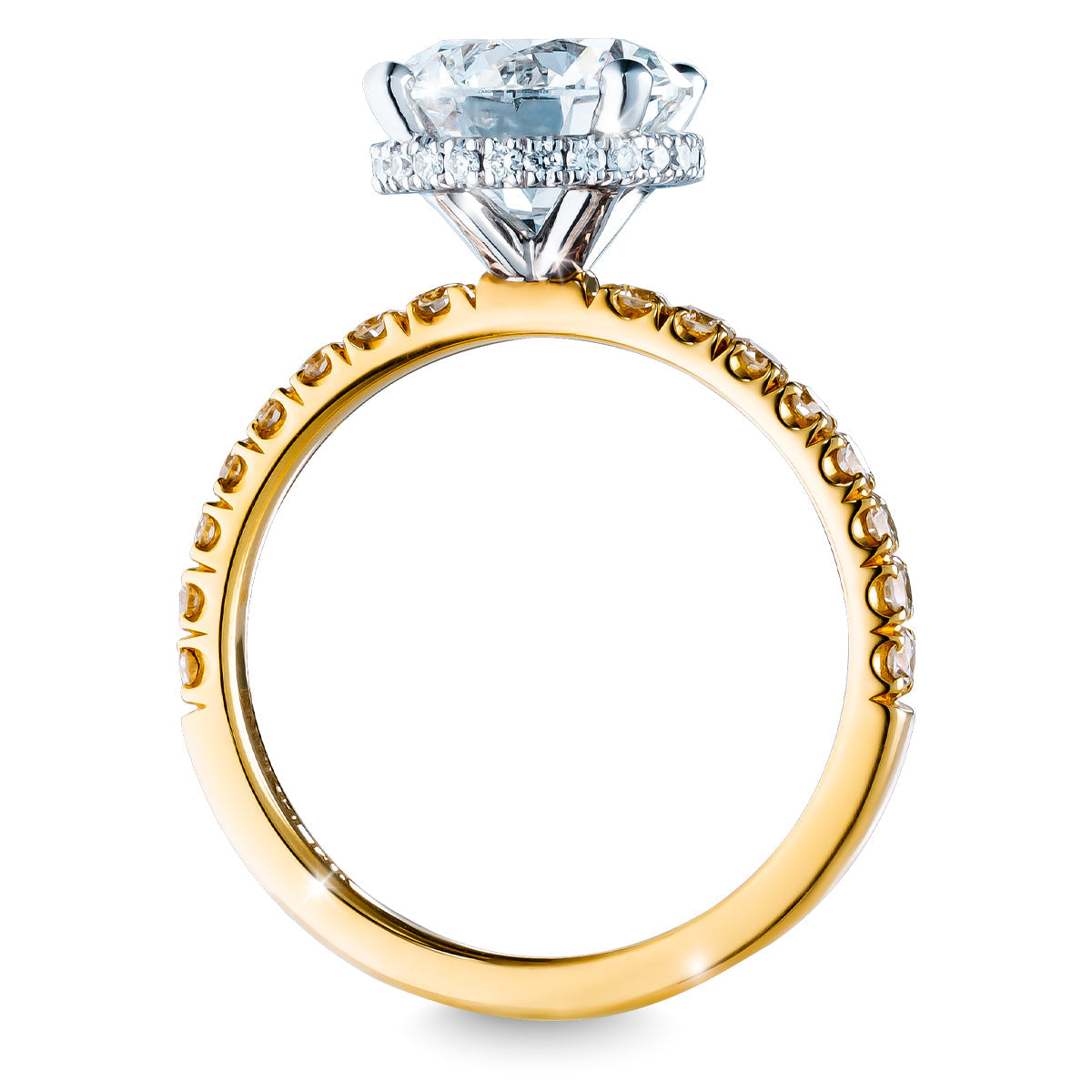 The Raffi&Co.® 14K Yellow Gold Round Brilliant Solitaire Lab Diamond Engagement Ring features a large lab diamond in a silver prong setting on a gold band, adorned with heart-shaped details and small diamonds, adding elegance without high cost.