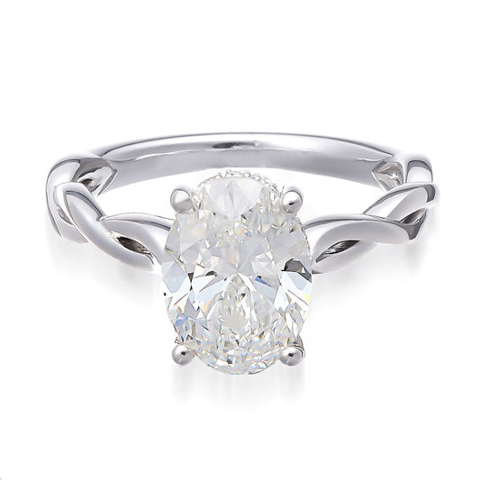 The Raffi&Co.® 14K white gold engagement ring showcases a hidden halo and round brilliant lab-created center diamond, set in a prong setting. Its band features a twisted, vine-like design with mined accent diamonds, enhancing its elegance.