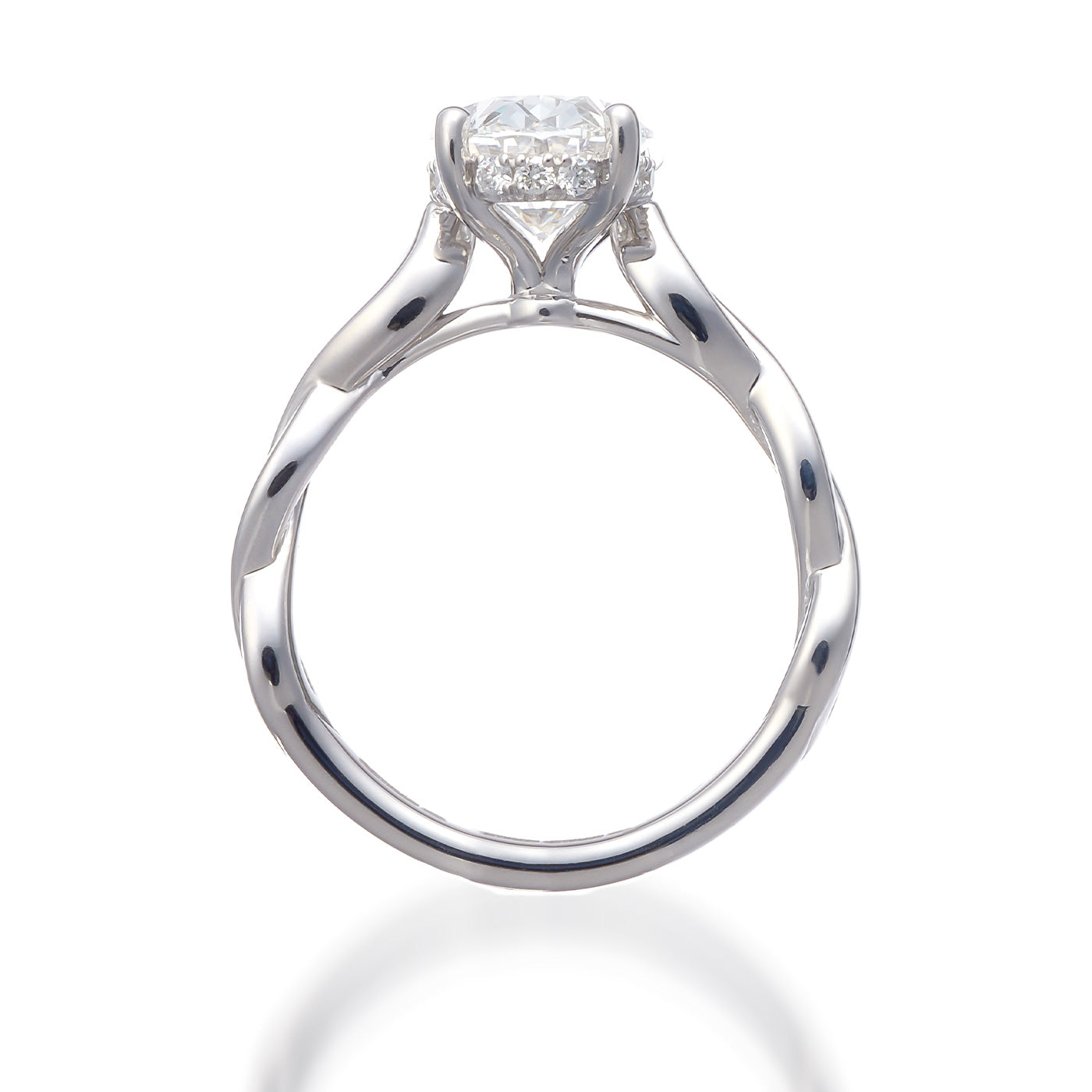 Close-up of the Raffi&Co.® engagement ring, showcasing a round, sparkling lab-created diamond in a six-prong setting with a hidden halo. The 14K white gold band offers a simple and elegant design, beautifully reflecting light against a white background.