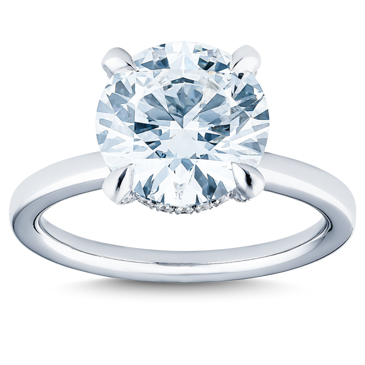 The Raffi&Co.® 14K White Gold Round Brilliant Lab Diamond Hidden Halo Engagement Ring features a smooth, polished band that enhances the brilliance of the large, round lab diamond solitaire in a prong setting, beautifully reflecting light.