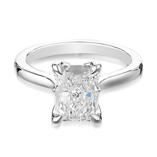 The Raffi&Co.® 14K White Gold Radiant Solitaire Lab Diamond Engagement Ring showcases a sparkling, rectangular 2.50 carat lab diamond set centrally on a sleek, polished band made from 14K white gold.