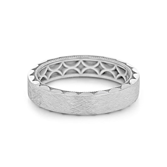 The Tacori Classic 18K White Gold Men's Wedding Band boasts a textured design with a striking geometric pattern on the inner band, highlighted by Tacori's signature sculpted crescent detail. It features a high polished outer edge and a matte surface, while the intricate honeycomb design on the interior adds an exquisite touch, perfect for unique engagement rings.
