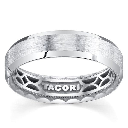 An 18K white gold Tacori men's wedding band with a classic brushed finish and polished edges. Designed by TACORI gemologists, the interior showcases intricate geometric patterns and has "TACORI" engraved inside.