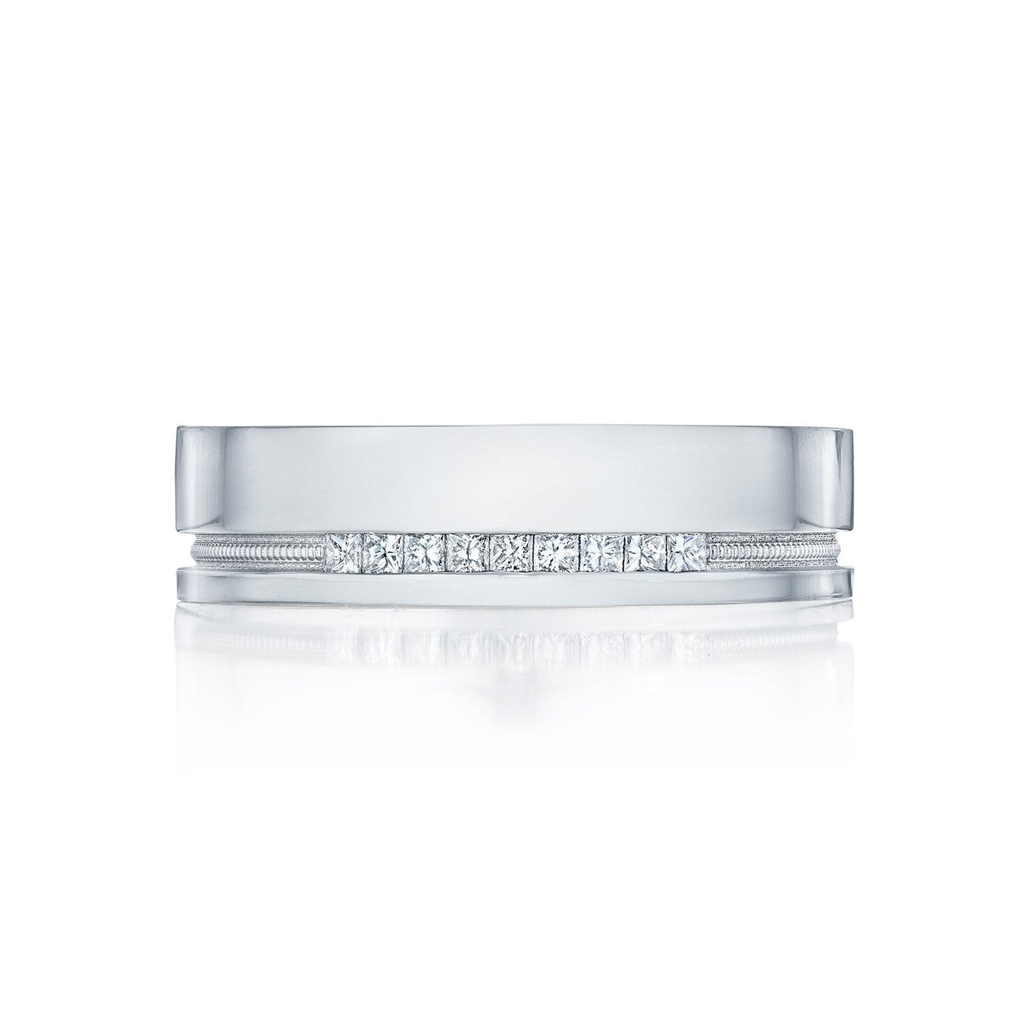A sophisticated Tacori High Polish Finish men's wedding band, crafted from 18K white gold and adorned with a row of round brilliant diamonds set along its center. This Tacori piece features a shiny, polished surface and a subtle bevel along the edges, exuding timeless elegance.