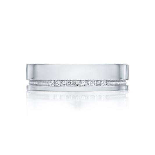 A sophisticated Tacori High Polish Finish men's wedding band, crafted from 18K white gold and adorned with a row of round brilliant diamonds set along its center. This Tacori piece features a shiny, polished surface and a subtle bevel along the edges, exuding timeless elegance.