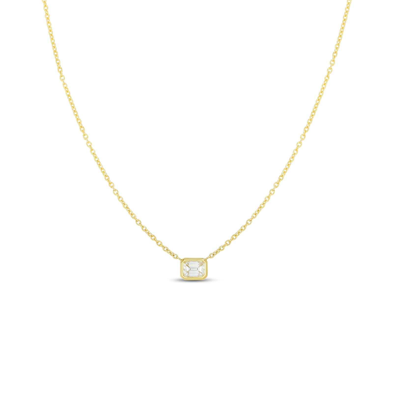 The Roberto Coin "Diamonds By The Inch" necklace showcases an 18k yellow gold chain paired with a square pendant, featuring an emerald-cut diamond at its center. This piece embodies simplicity and elegance as its thin and sophisticated chain enhances the subtle sparkle of the small pendant.