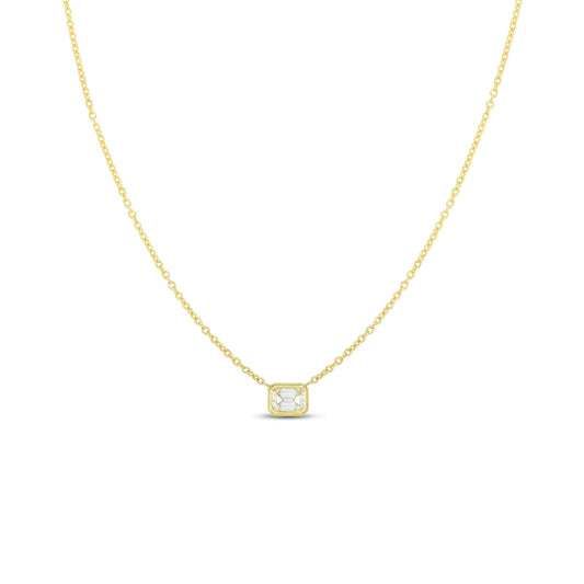 The Roberto Coin "Diamonds By The Inch" necklace showcases an 18k yellow gold chain paired with a square pendant, featuring an emerald-cut diamond at its center. This piece embodies simplicity and elegance as its thin and sophisticated chain enhances the subtle sparkle of the small pendant.