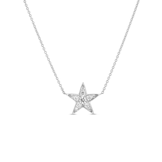 The Roberto Coin Tiny Treasures 18 Karat White Gold Diamond Five Point Star Necklace Pendant is a delicate jewelry piece from Roberto Coin, featuring a star-shaped pendant adorned with sparkling round diamonds. The thin 18 Karat White Gold chain enhances the exquisite and minimalist design of this necklace.