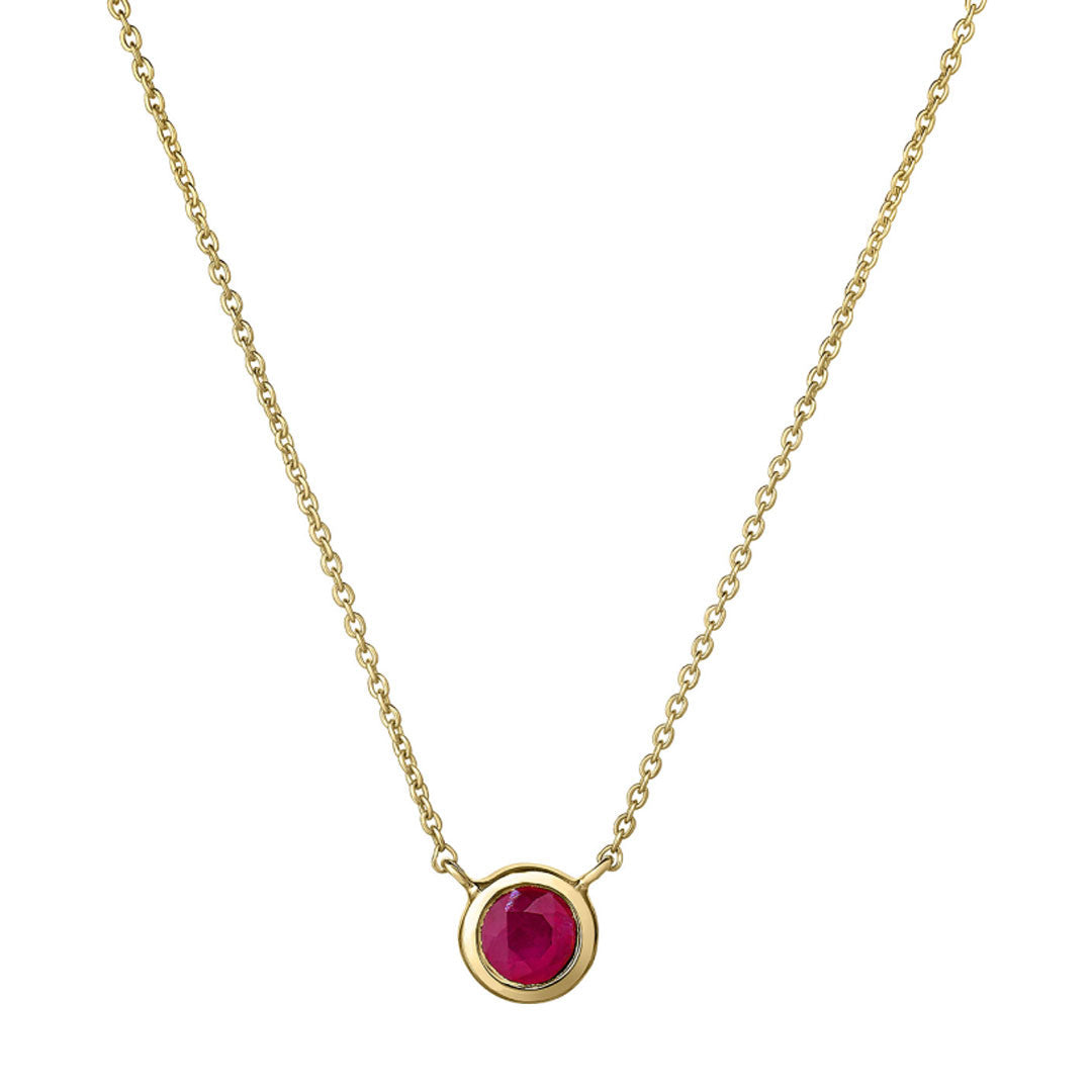Introducing the Roberto Coin Tiny Treasure 18K Yellow Gold Ruby Bezel Necklace Pendant, featuring a small round 0.30 CT ruby set at the center of a simple yellow gold bezel.