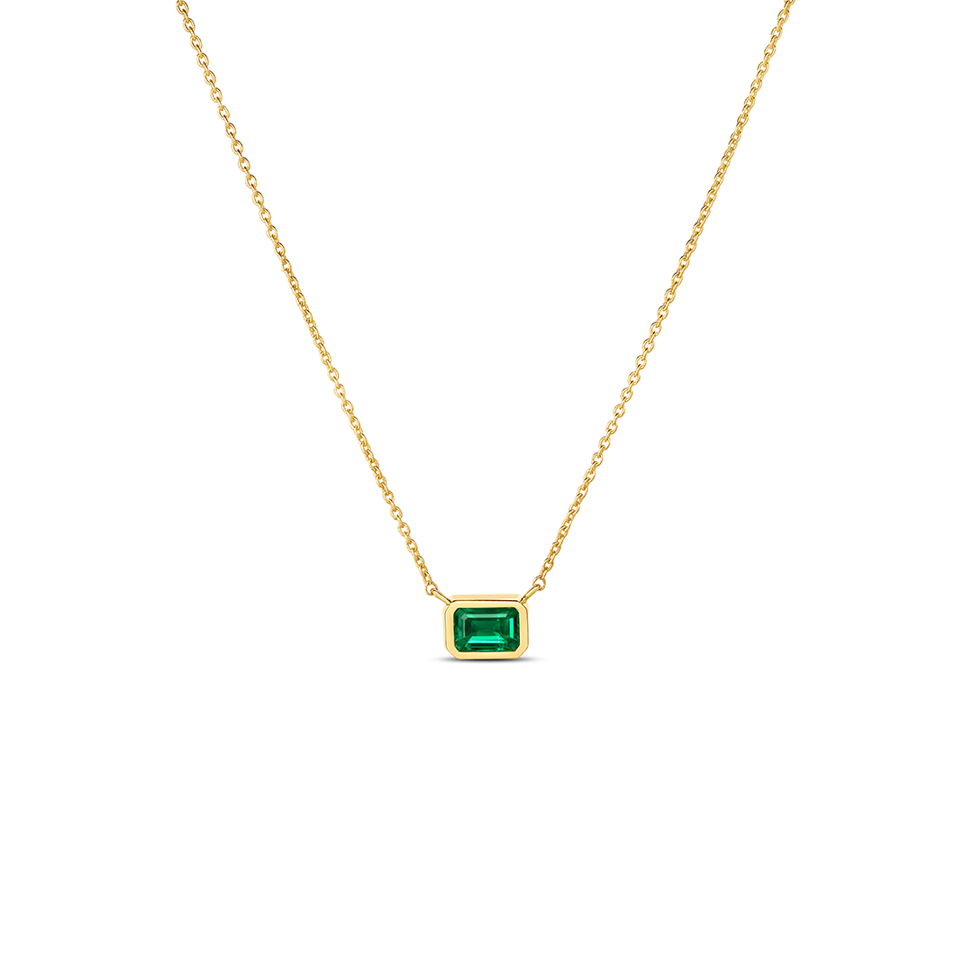 Roberto Coin Tiny Treasures 18K Yellow Gold Emerald Necklace Pendant featuring a rectangular emerald in a bezel setting on an 18K yellow gold chain.