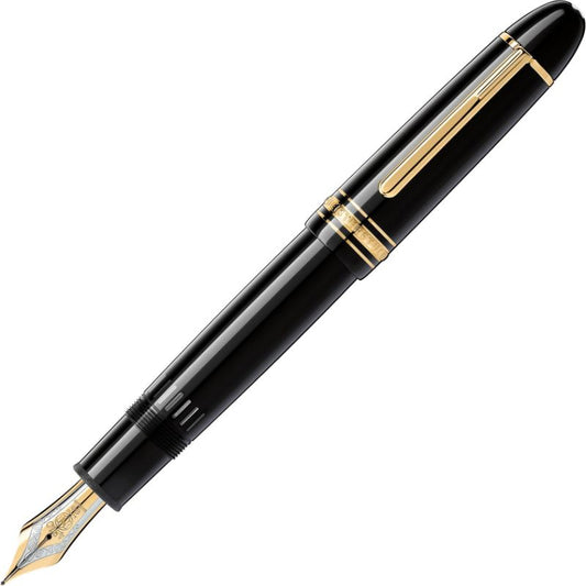 A Montblanc Meisterstuck 149 Fountain Pen, featuring a black body with gold accents and a pointed nib, rests at an angle on a white background. The Montblanc pen showcases elegant detailing and a sleek design.