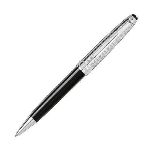 A Montblanc Meisterstuck Unicef Doué Classique ballpoint pen, showcasing a sophisticated black barrel and a transparent, textured cap. The pen is elegantly angled to the right against a plain white background, representing both elegance and support for literacy education initiatives.